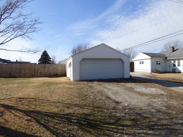 garage featuring a lawn