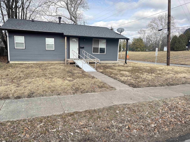 ranch-style house with a front lawn