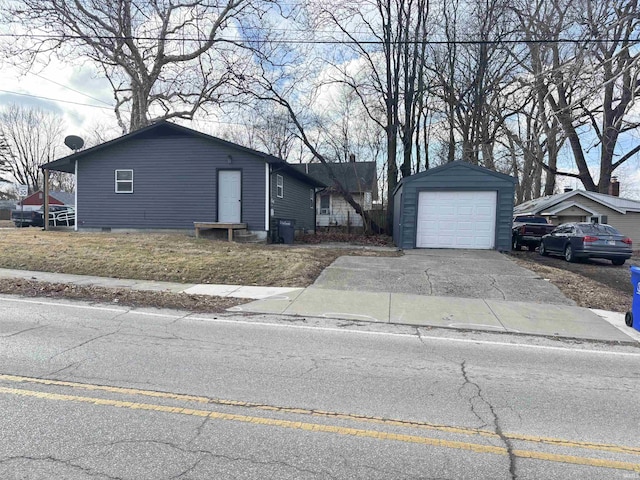 single story home with an outbuilding and a garage