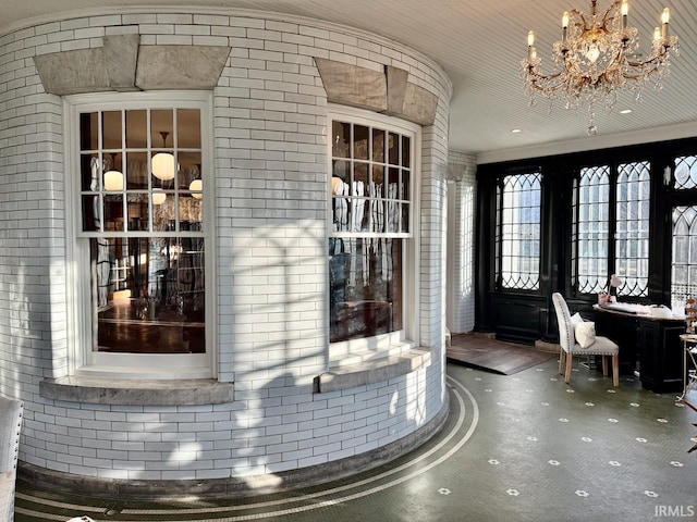 entrance foyer with an inviting chandelier and carpet floors