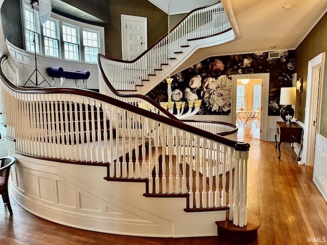 stairs with hardwood / wood-style flooring