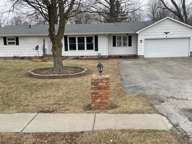 single story home with a garage and a front lawn