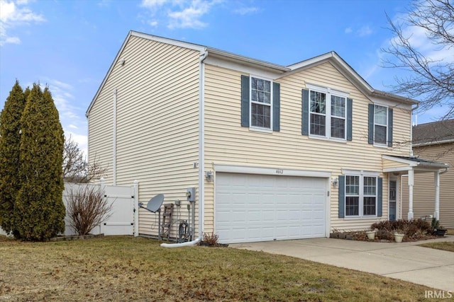 view of side of property with a garage and a yard