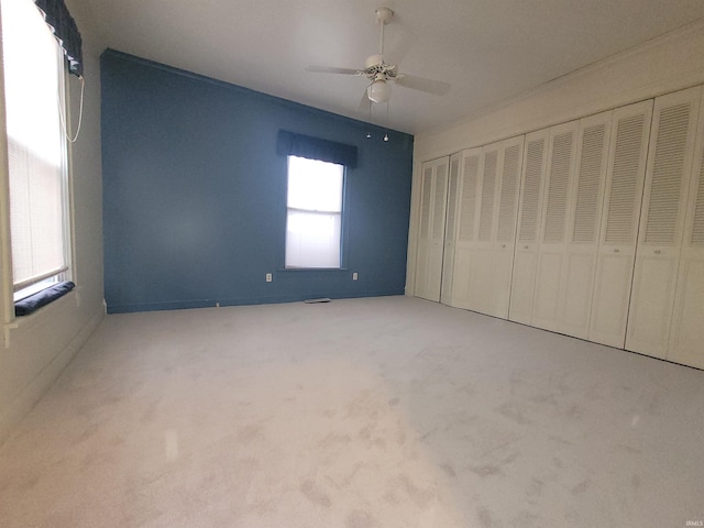 unfurnished bedroom with a closet, ceiling fan, and carpet