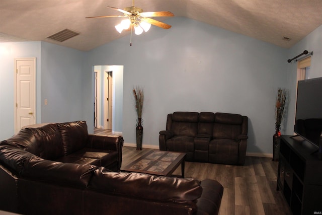 living room featuring ceiling fan, lofted ceiling, and dark hardwood / wood-style floors