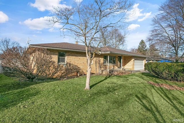 view of front of home featuring a garage and a front yard