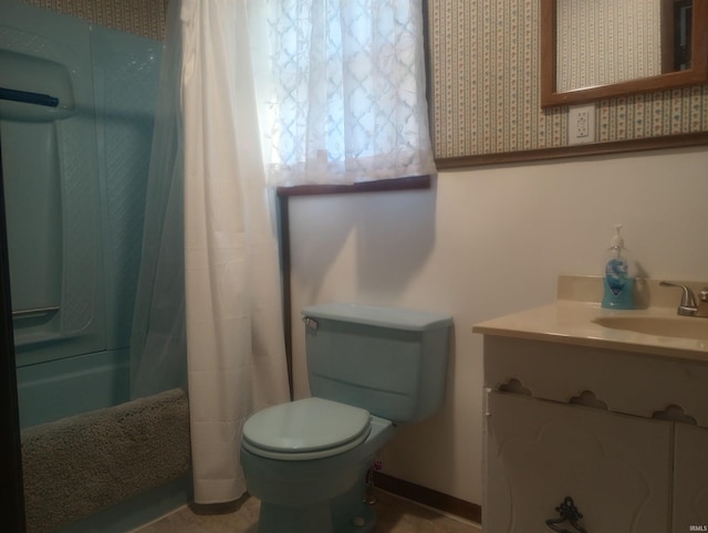 bathroom with vanity and toilet