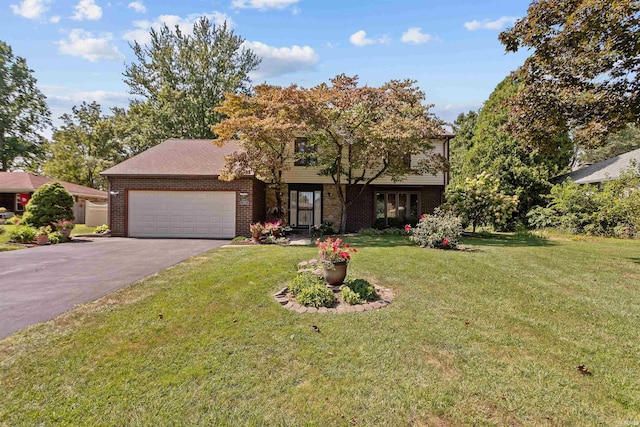 view of front of property featuring a garage and a front lawn