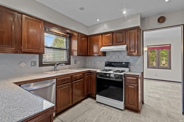 kitchen featuring sink, a wealth of natural light, range with gas stovetop, and dishwasher