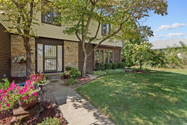 entrance to property with a yard