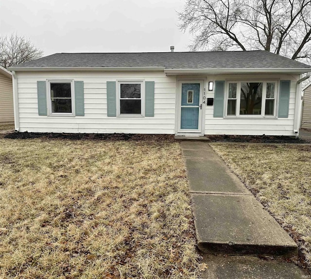 ranch-style home with a front lawn