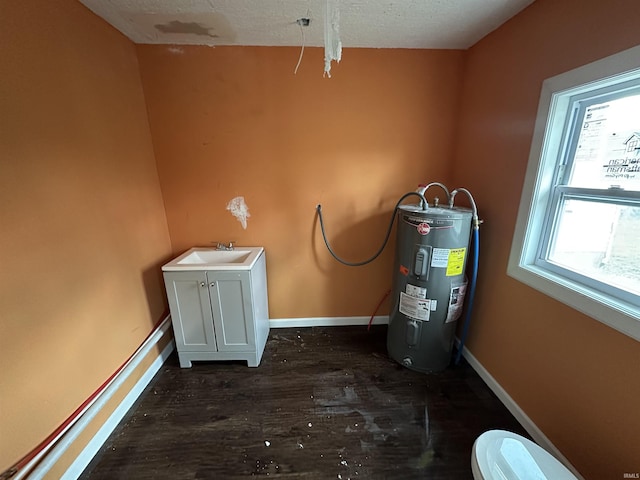 interior space with water heater and sink