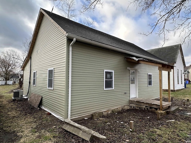 view of home's exterior with central AC unit