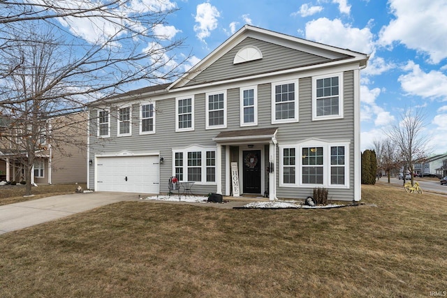 view of front of property with a garage and a front yard