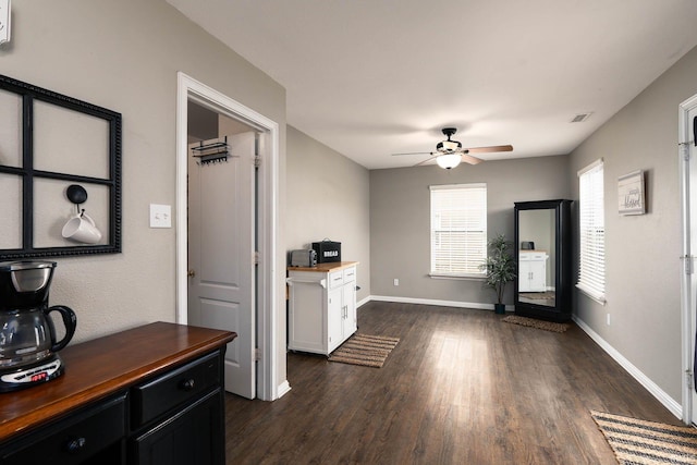 interior space featuring dark hardwood / wood-style floors and ceiling fan