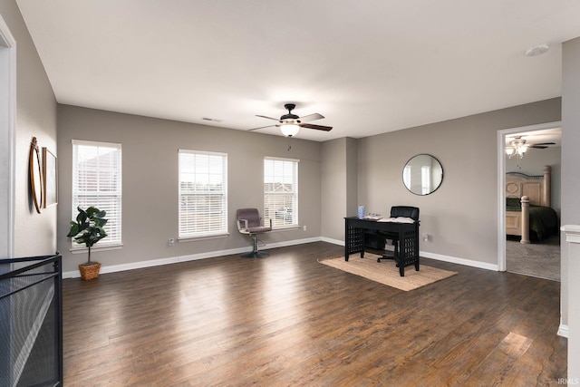 office area featuring dark wood-type flooring and ceiling fan