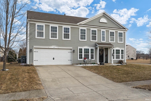 view of front of property featuring a garage and a front lawn