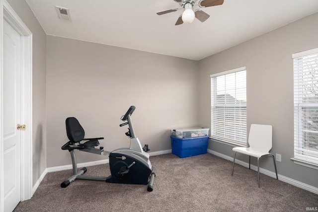 workout area with ceiling fan and carpet flooring