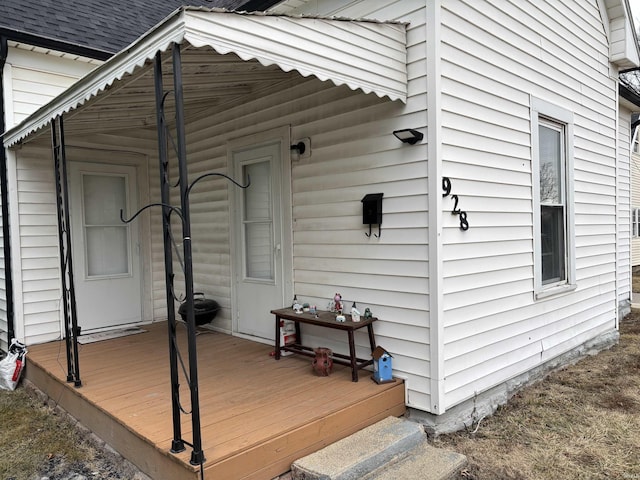 view of home's exterior with a wooden deck