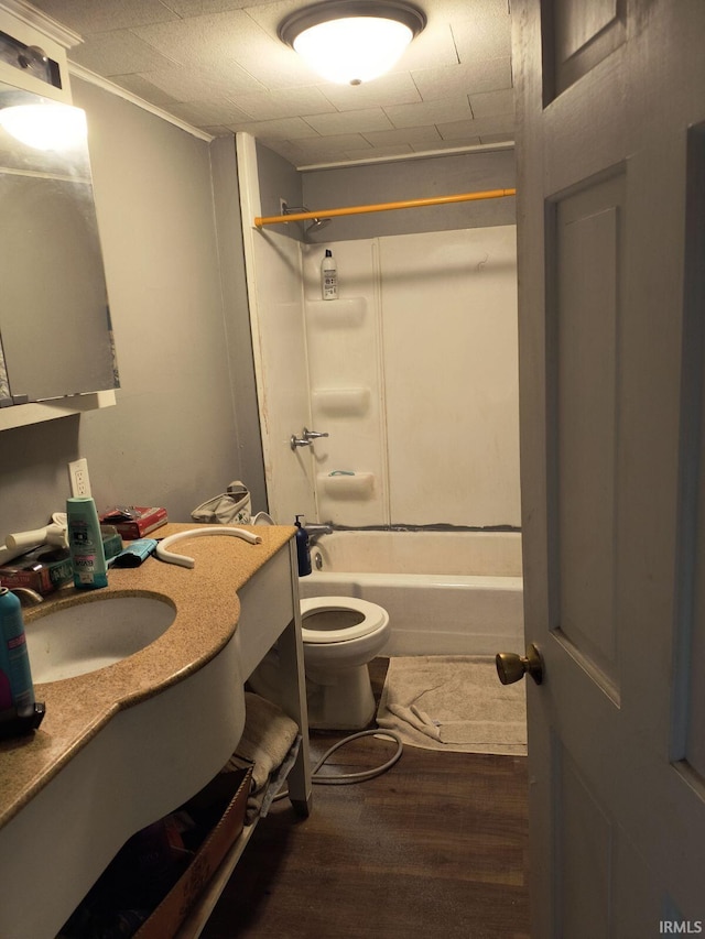 full bathroom with vanity, hardwood / wood-style flooring, shower / tub combination, and toilet