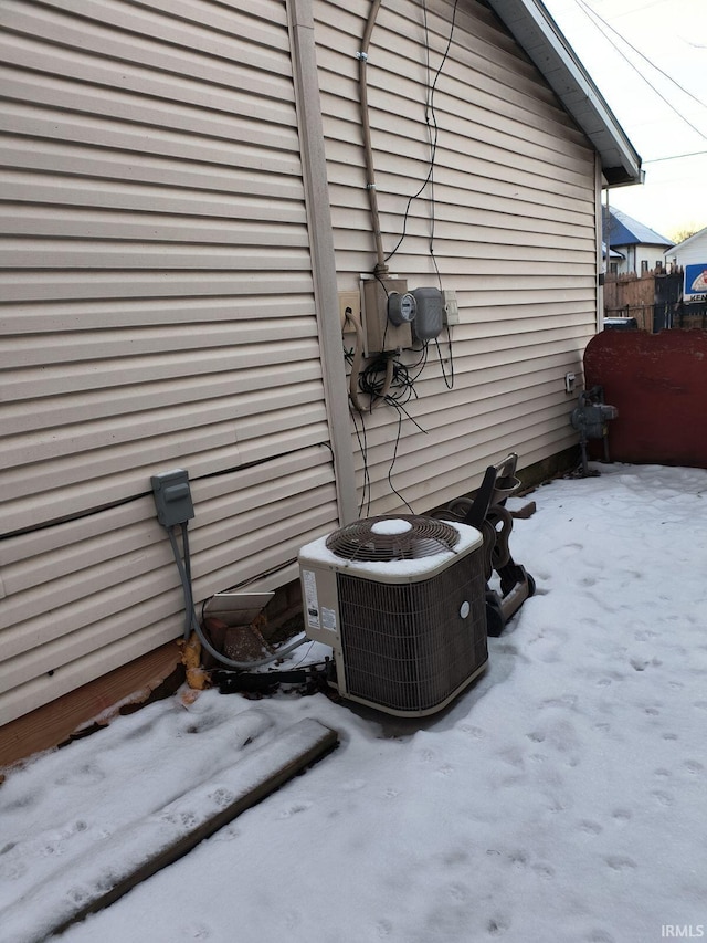 view of side of home featuring central AC unit