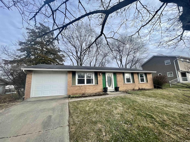 single story home featuring a garage and a front yard