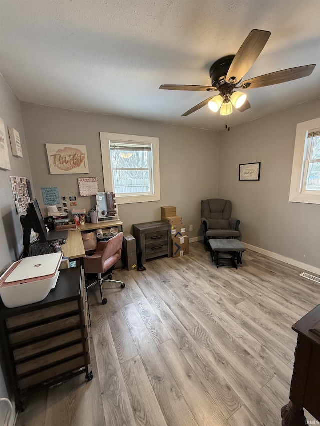 office area featuring ceiling fan and light wood-type flooring