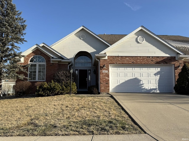 view of front facade featuring a garage and a front yard