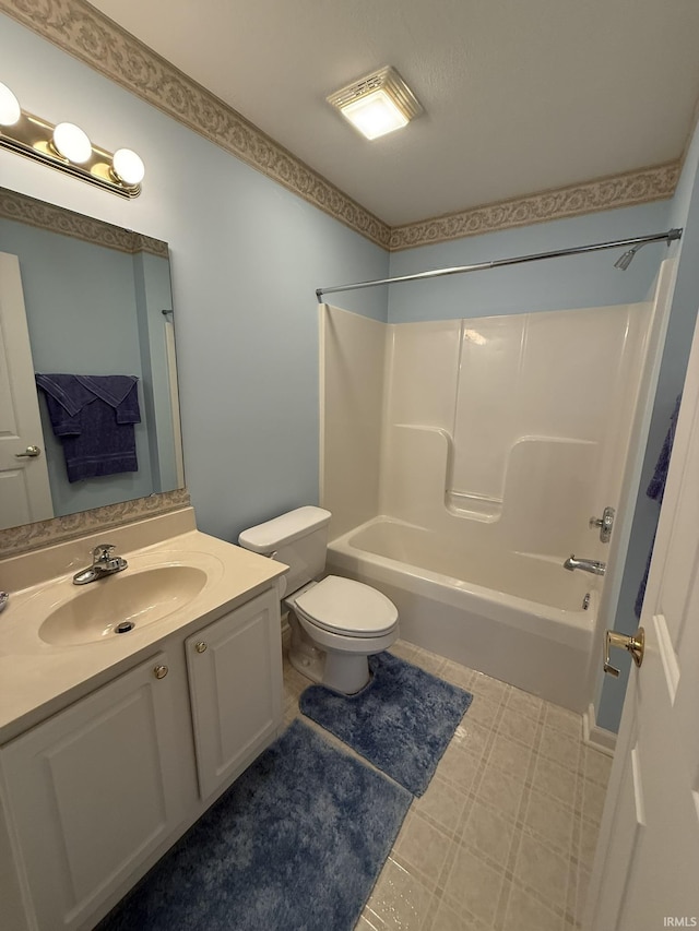 full bathroom featuring vanity, bathing tub / shower combination, and toilet