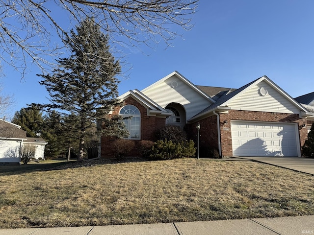 view of front of property with a garage and a front yard