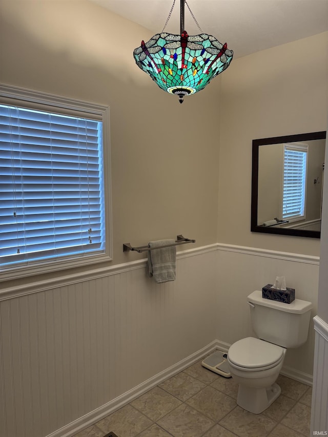 bathroom featuring tile patterned floors and toilet