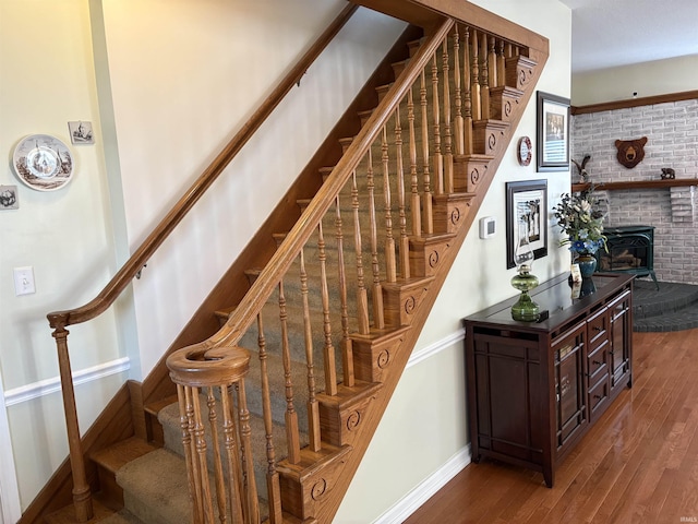 staircase with hardwood / wood-style flooring