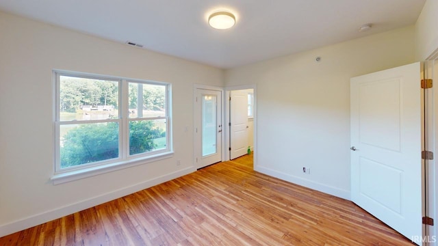 unfurnished bedroom featuring light wood-type flooring