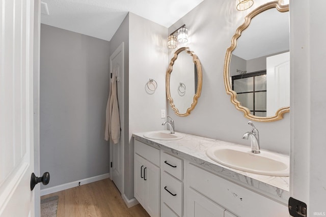 bathroom featuring vanity and hardwood / wood-style floors