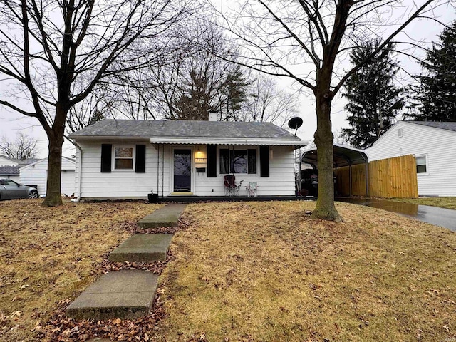 view of front of property with a carport