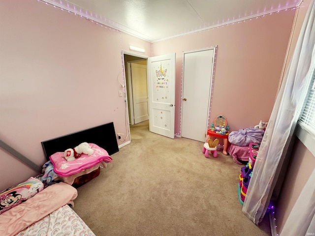 bedroom with light colored carpet and ornamental molding