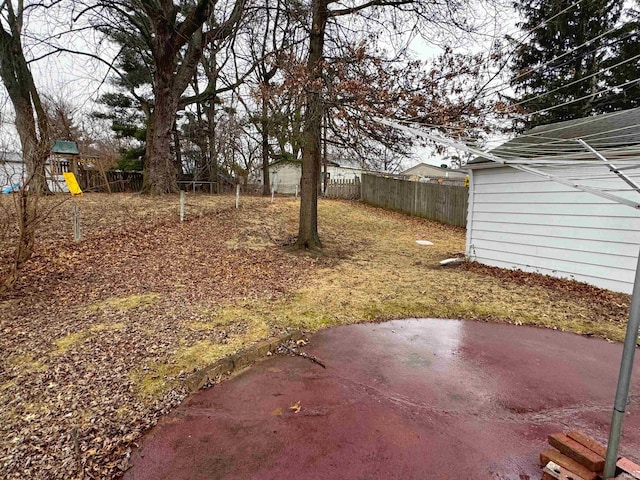 view of yard featuring a patio and a playground