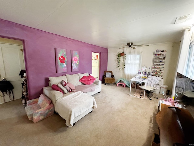 living room with carpet and ceiling fan