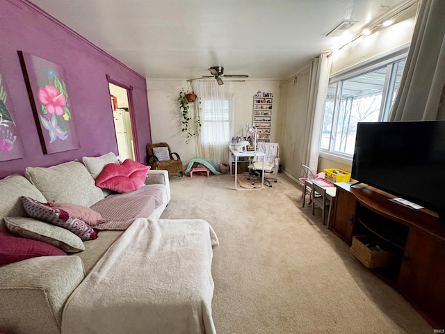 carpeted living room featuring ceiling fan