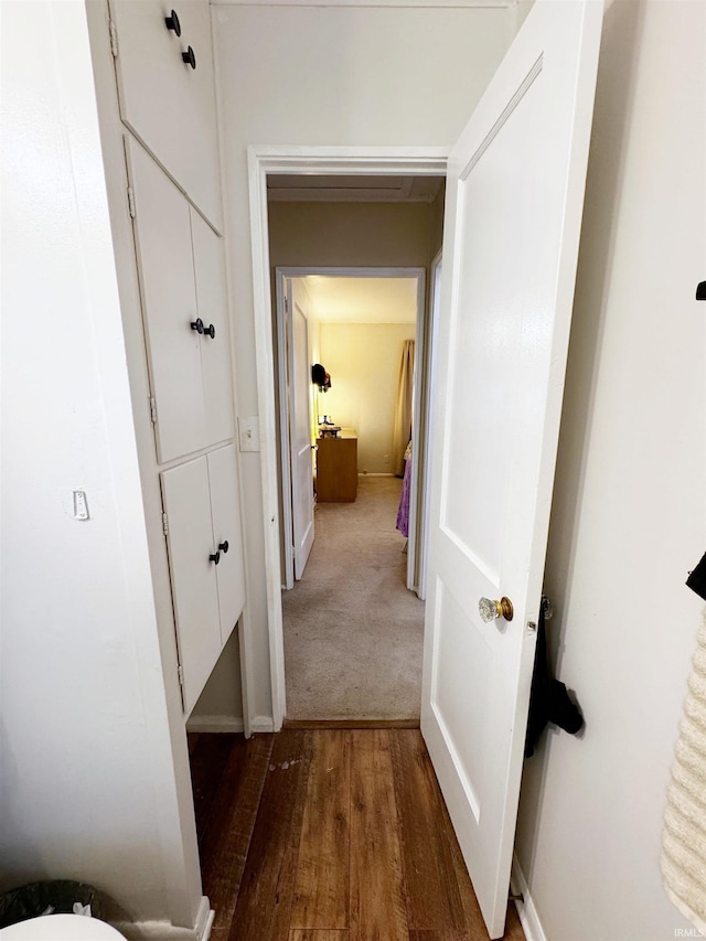 hall with dark hardwood / wood-style floors