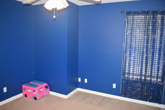 interior space featuring ceiling fan and carpet floors