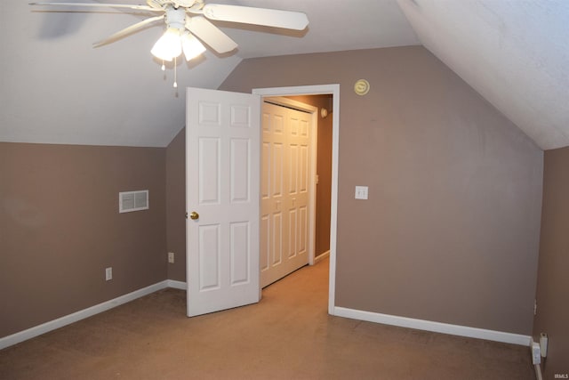 bonus room featuring ceiling fan, lofted ceiling, and light carpet