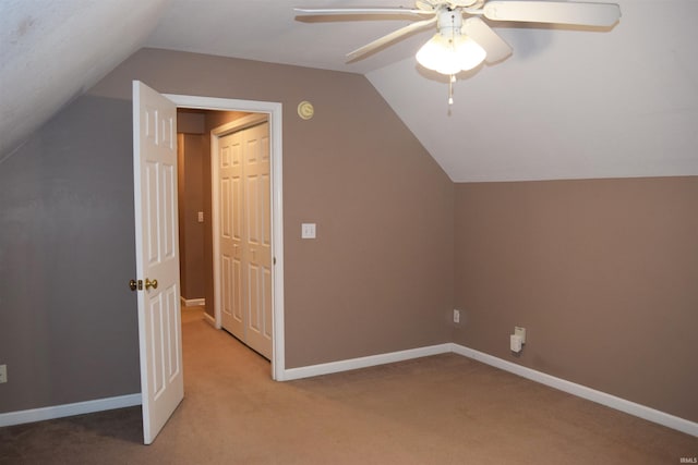 bonus room featuring lofted ceiling, ceiling fan, and carpet flooring