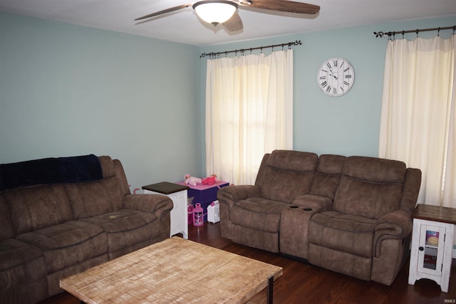 living room featuring dark hardwood / wood-style floors and ceiling fan