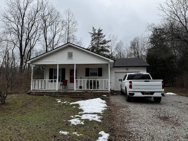 view of front of property with a garage and a porch