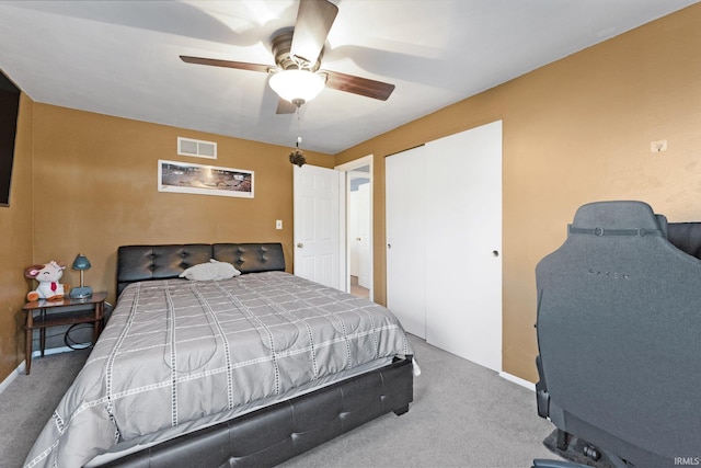 bedroom featuring carpet flooring, ceiling fan, and a closet