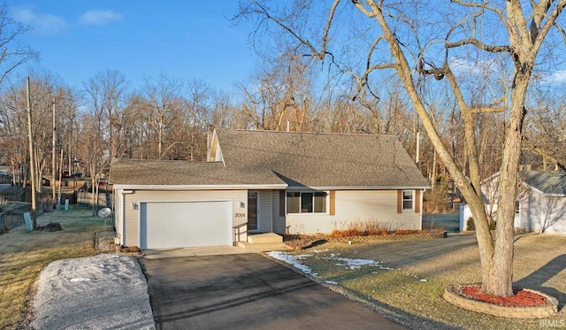 ranch-style home with a garage