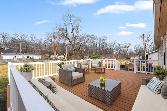 wooden deck with an outdoor living space