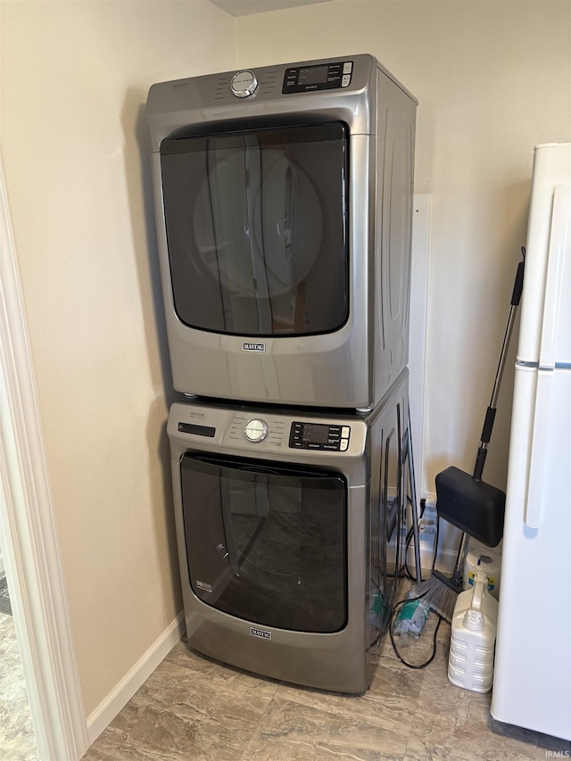 laundry room featuring stacked washer / dryer