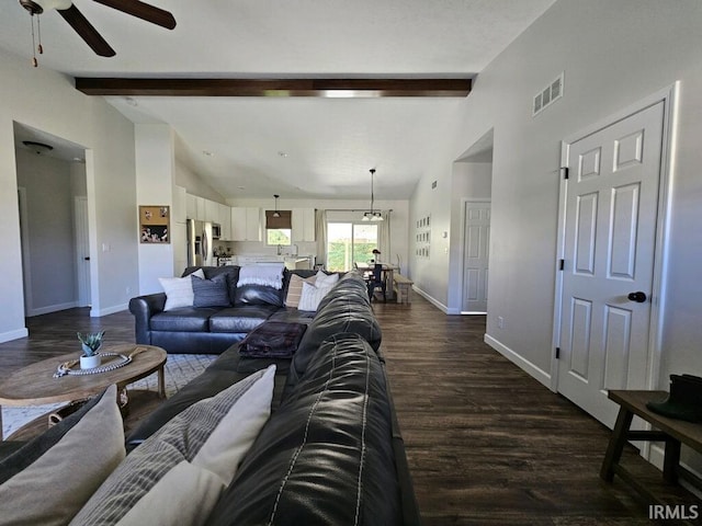 living room featuring vaulted ceiling with beams, dark hardwood / wood-style floors, and ceiling fan